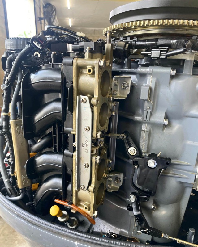 Outboard marine engine being serviced on location